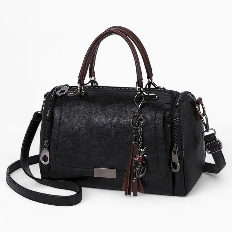 Sac à main cuir noir avec pompon